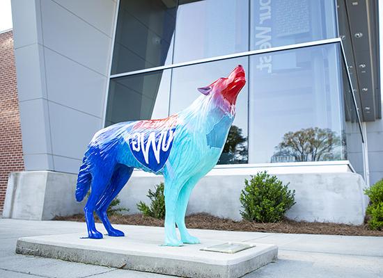 wolf statue in front of Admissions building